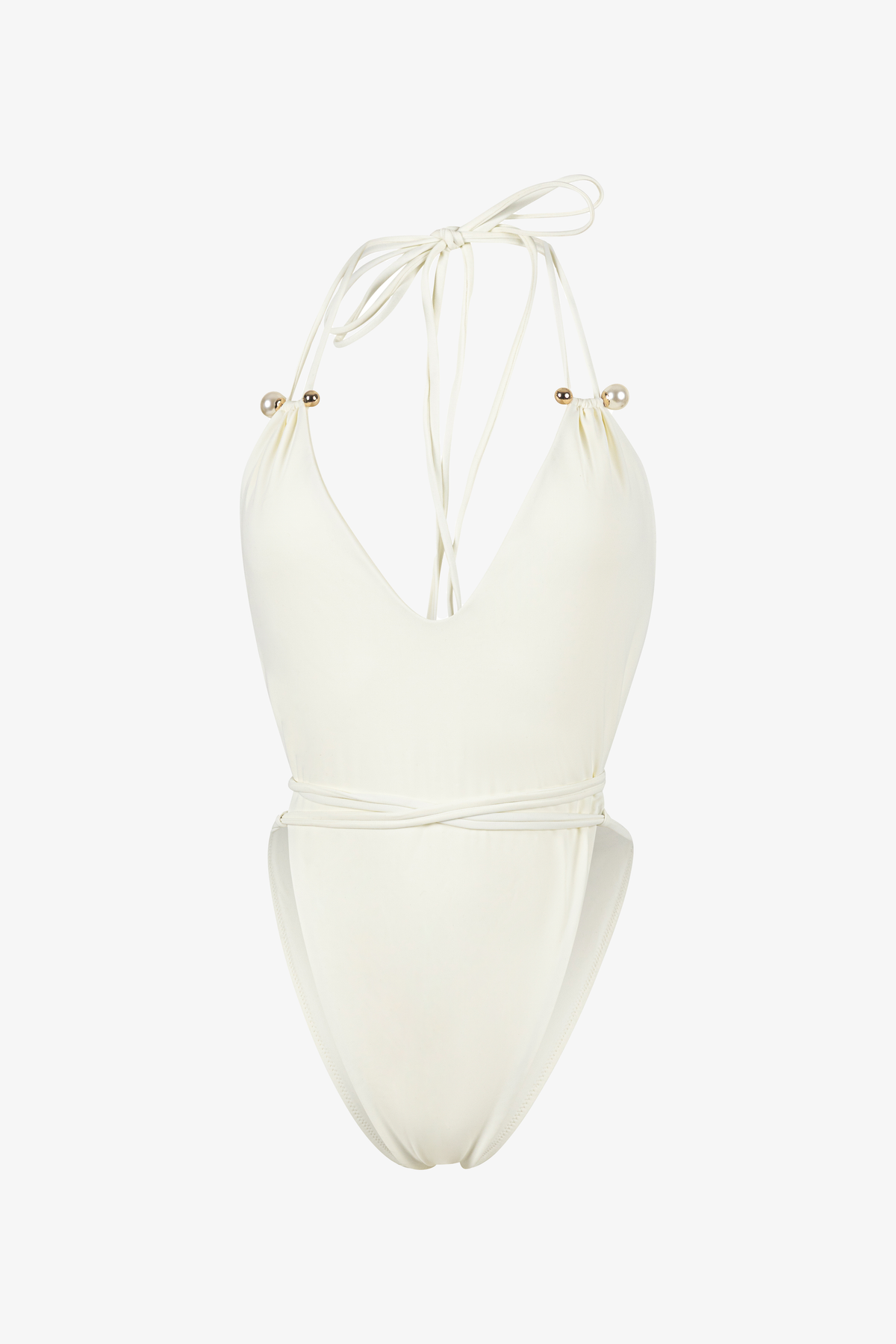 White swimsuit with gold embellishments on a white background